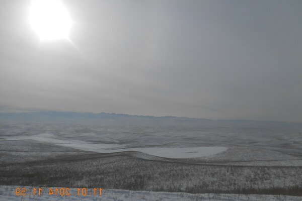 Winter horizon with bright sun