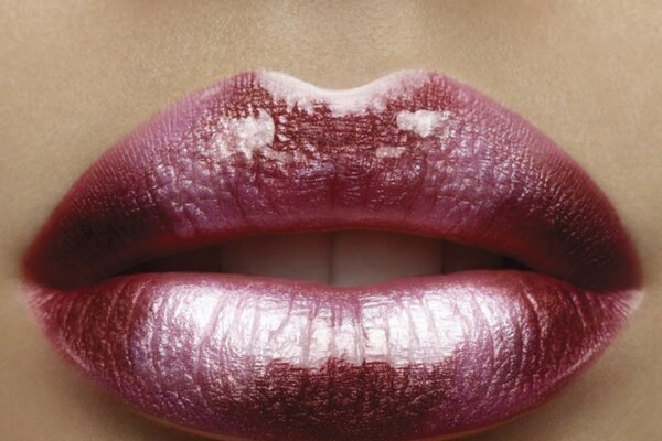 Lips brightly painted with lipstick