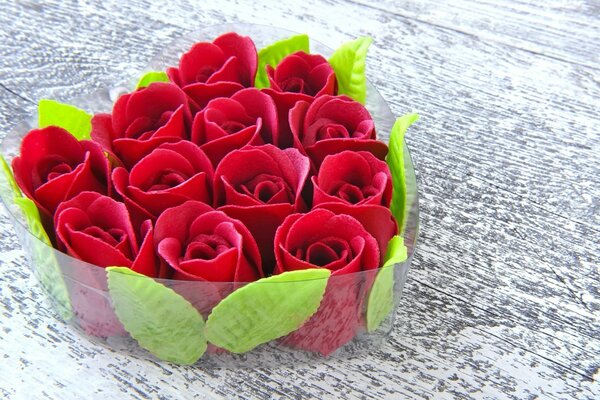 Bouquet of red flowers in the form of a heart