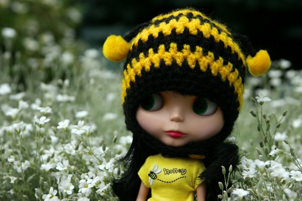 Doll in a hat in nature macro photography