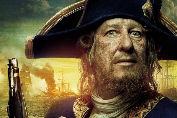 The captain from the movie Pirates of the Caribbean on the background of burning ships