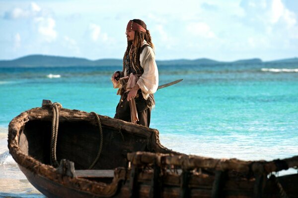 Jack Sparrow near the boat on the seashore