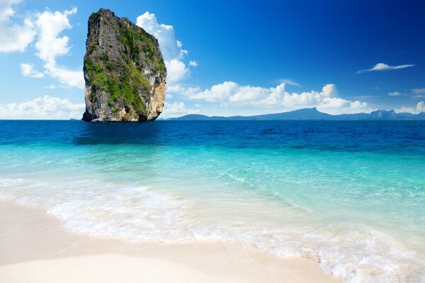 A lonely island on the background of the sea surface