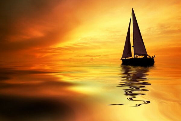 Sailboat in the ocean on the background of sunset