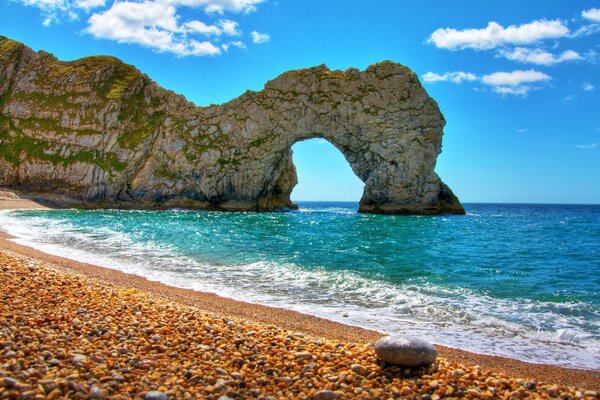 An unusual beautiful rock on the background of the sea