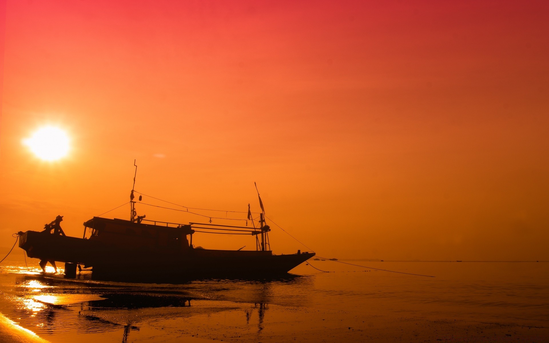 sea and ocean sunset dawn water sea ocean beach sun backlit dusk silhouette evening watercraft fisherman boat seashore seascape sky reflection transportation system