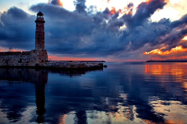 Reflection of the lighthouse on the sea surface