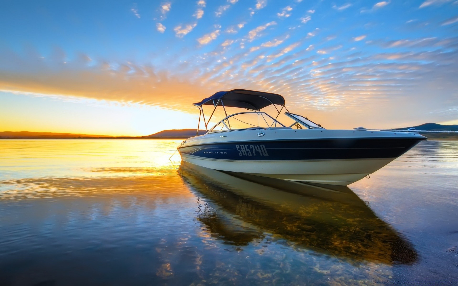 sea and ocean water sunset sea sun ocean sky boat travel dawn watercraft fair weather summer dusk beach reflection