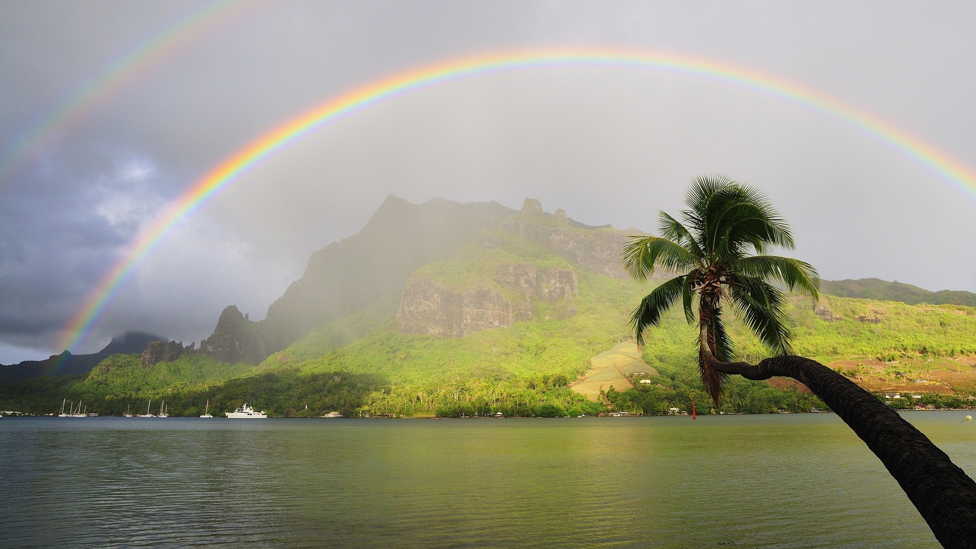 sea and ocean rainbow landscape tree water lake reflection beach nature mountain sky island scenic travel summer ocean seashore cloud river storm