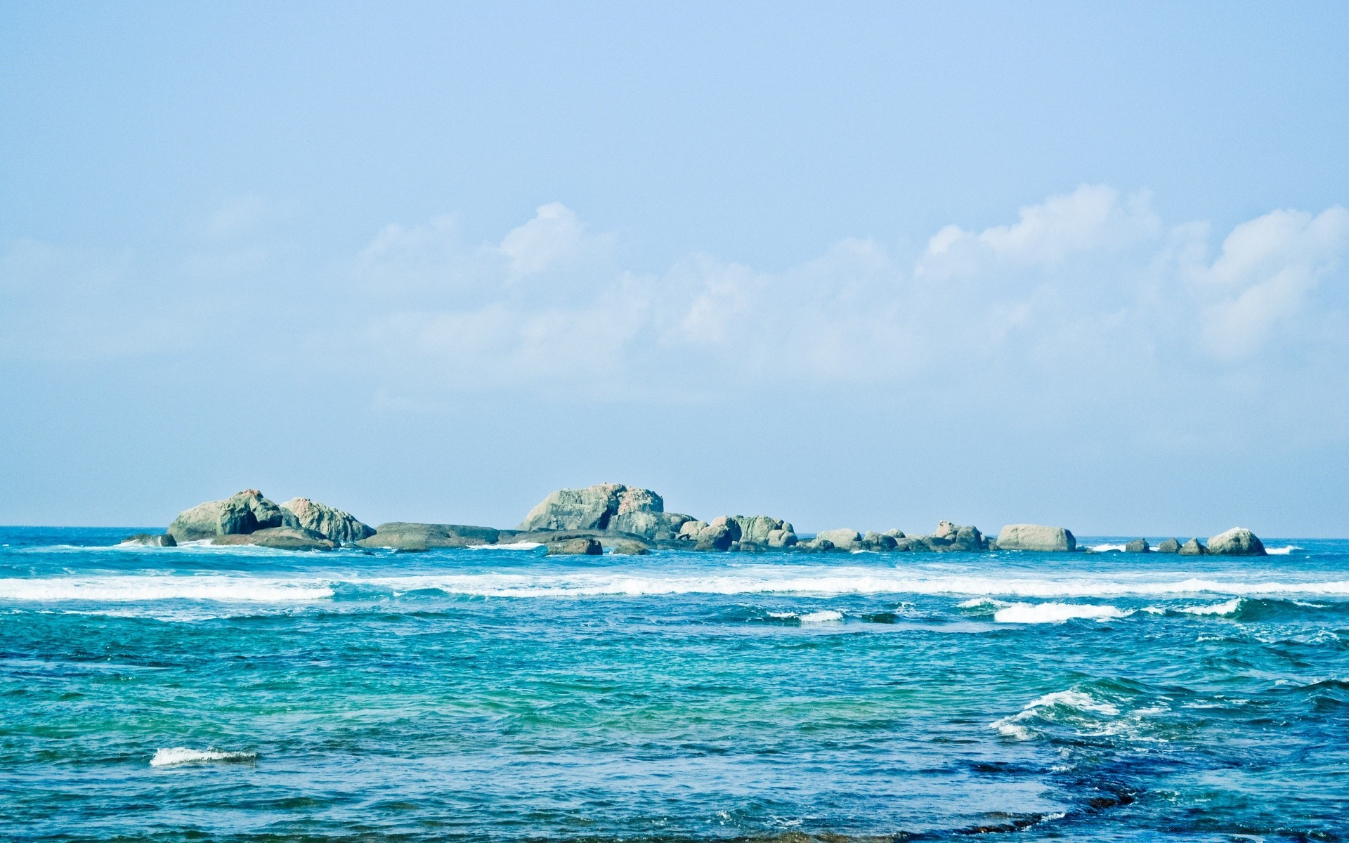 sea and ocean water sea travel beach summer sky ocean seashore island landscape sand outdoors nature tropical sun vacation seascape fair weather wave