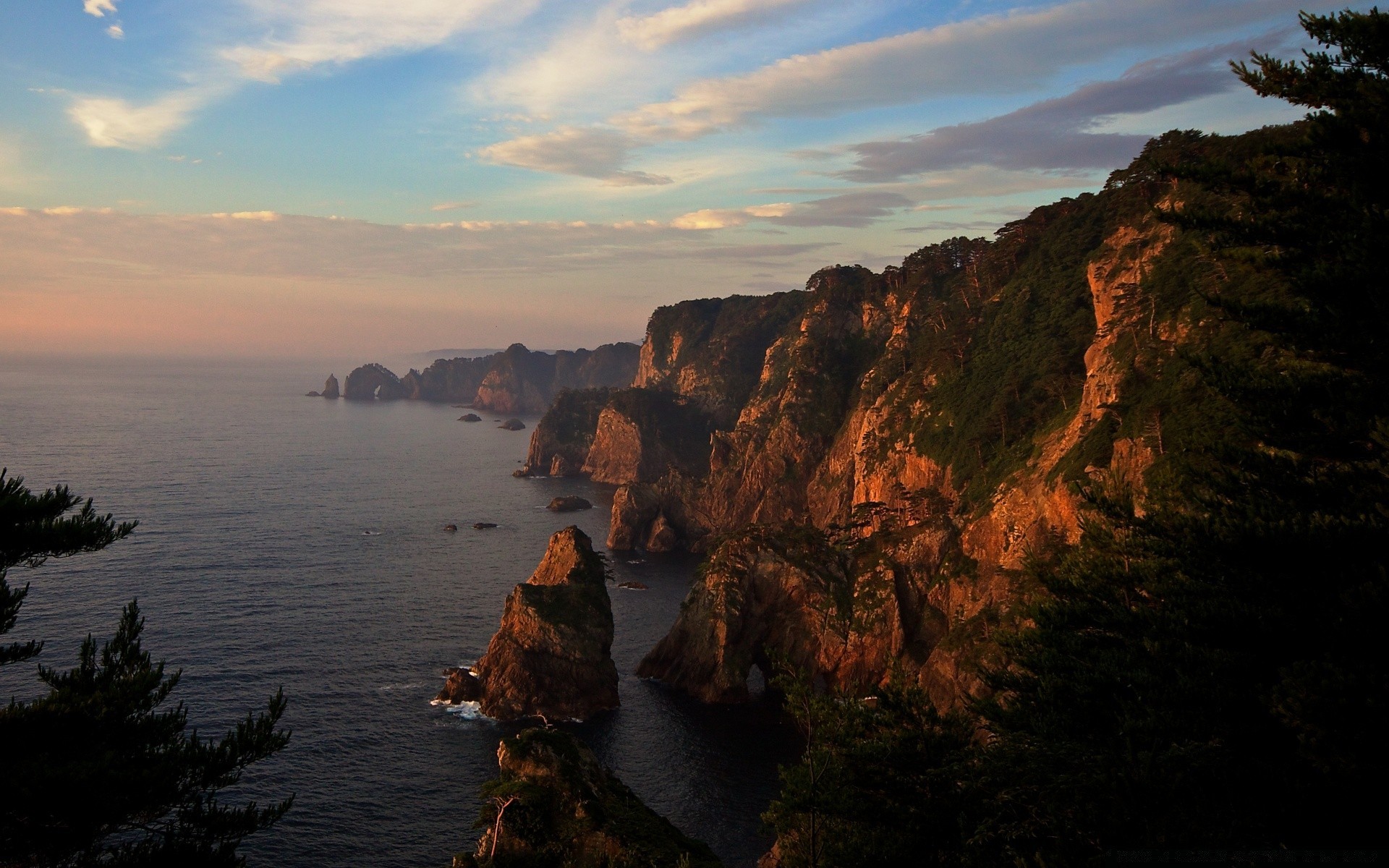 mer et océan coucher de soleil eau paysage aube mer soir crépuscule mer plage ciel voyage océan à l extérieur rock nature paysage montagnes réflexion