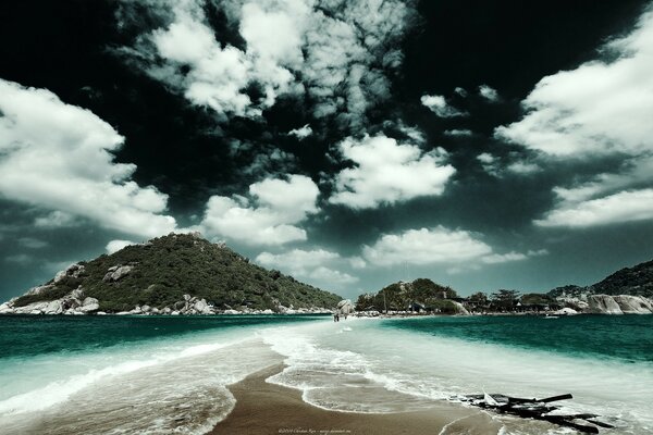 Lush white clouds over the green ocean water