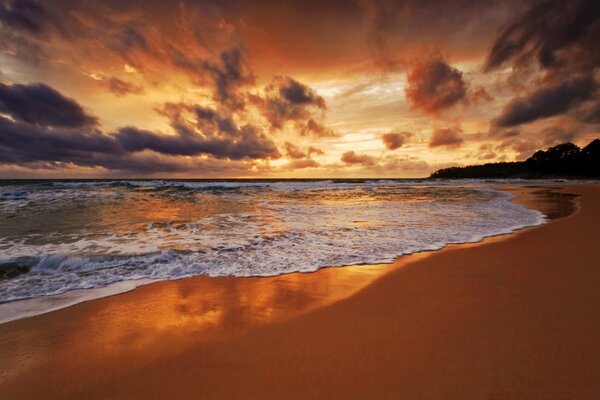 A beach sunset followed by dusk