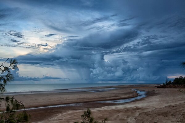 Sandy seashore and blue sky