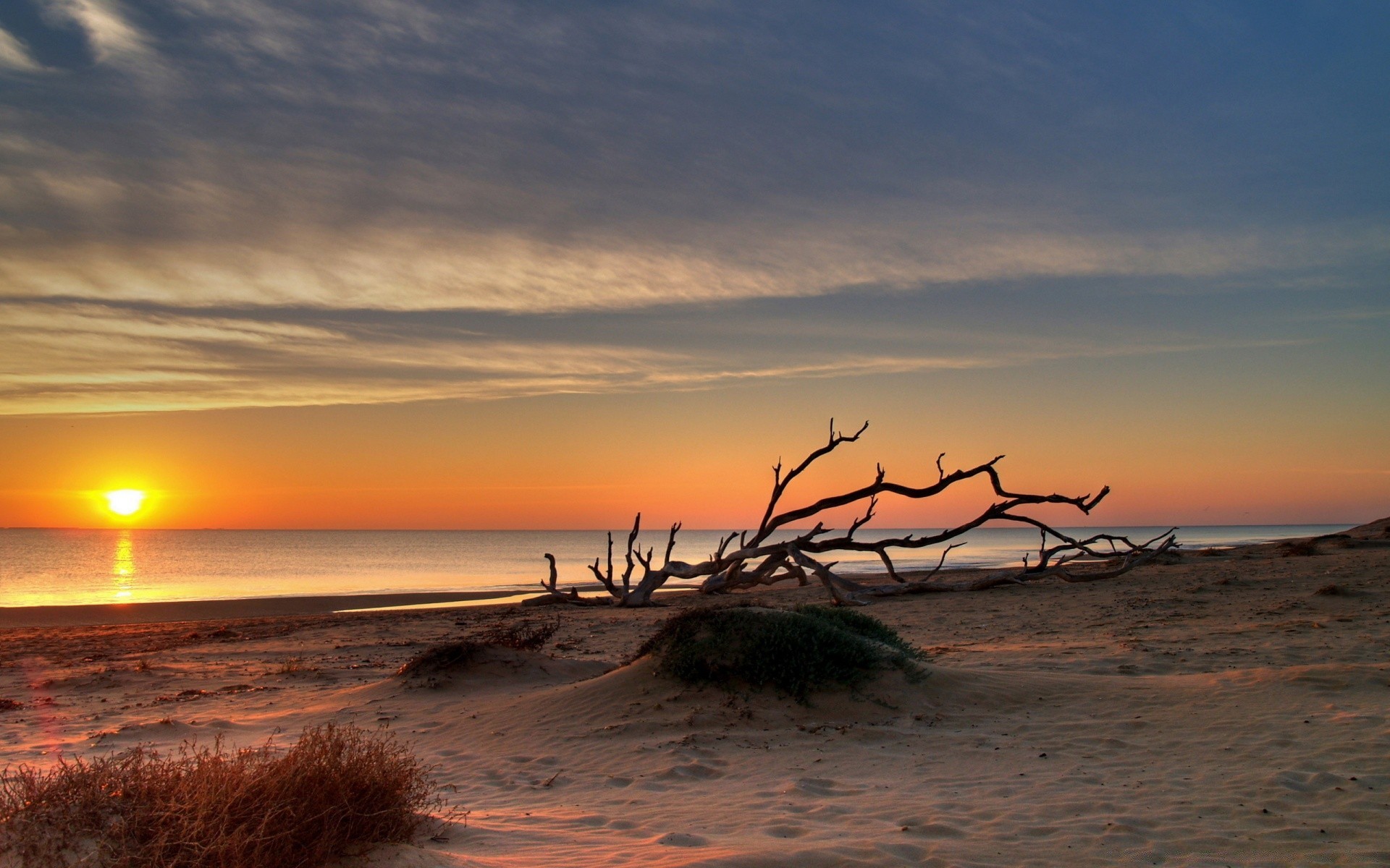 sea and ocean sunset sun dawn water beach dusk evening sand sea ocean sky summer fair weather landscape nature silhouette seashore seascape travel