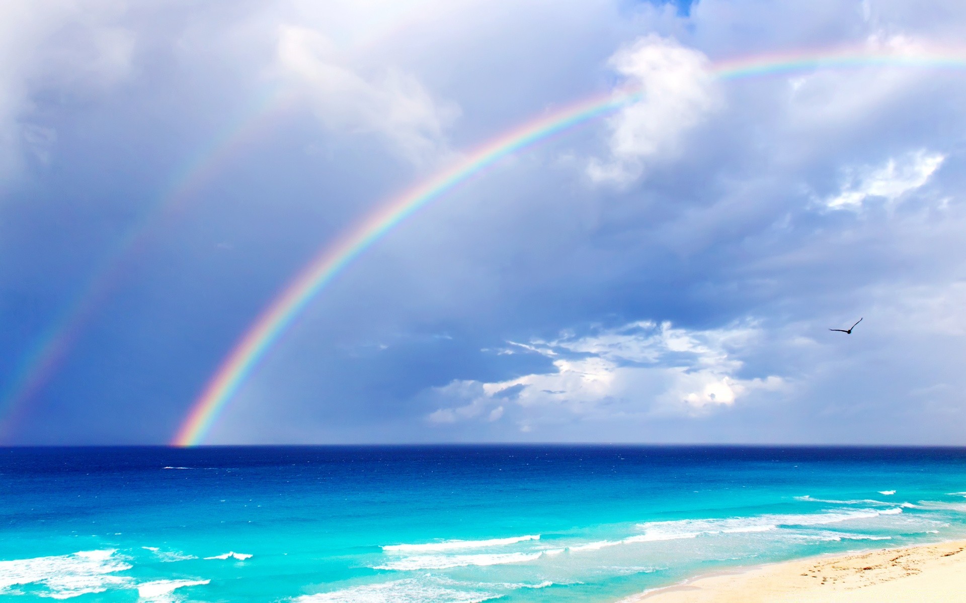 sea and ocean rainbow water sky landscape beach summer sun nature ocean sand weather sea travel seashore fair weather scenic outdoors seascape heaven