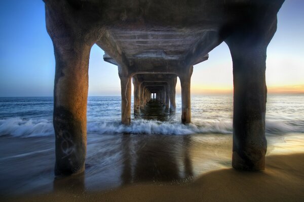 Foam waves wash over the architecture