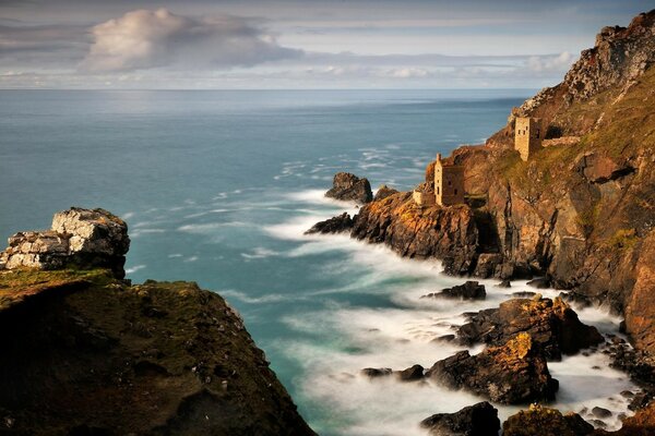 Rocky coast with ancient houses