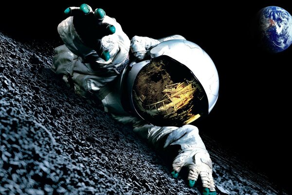 一名宇航员在地球的背景下在月球上爬行