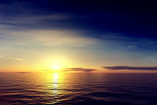 The sun at dawn is reflected in the sea water