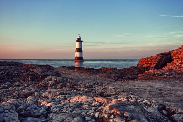 Lighthouse on the background of the sea