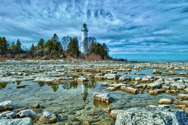 Ocean. A lonely lighthouse. Sky. Nature