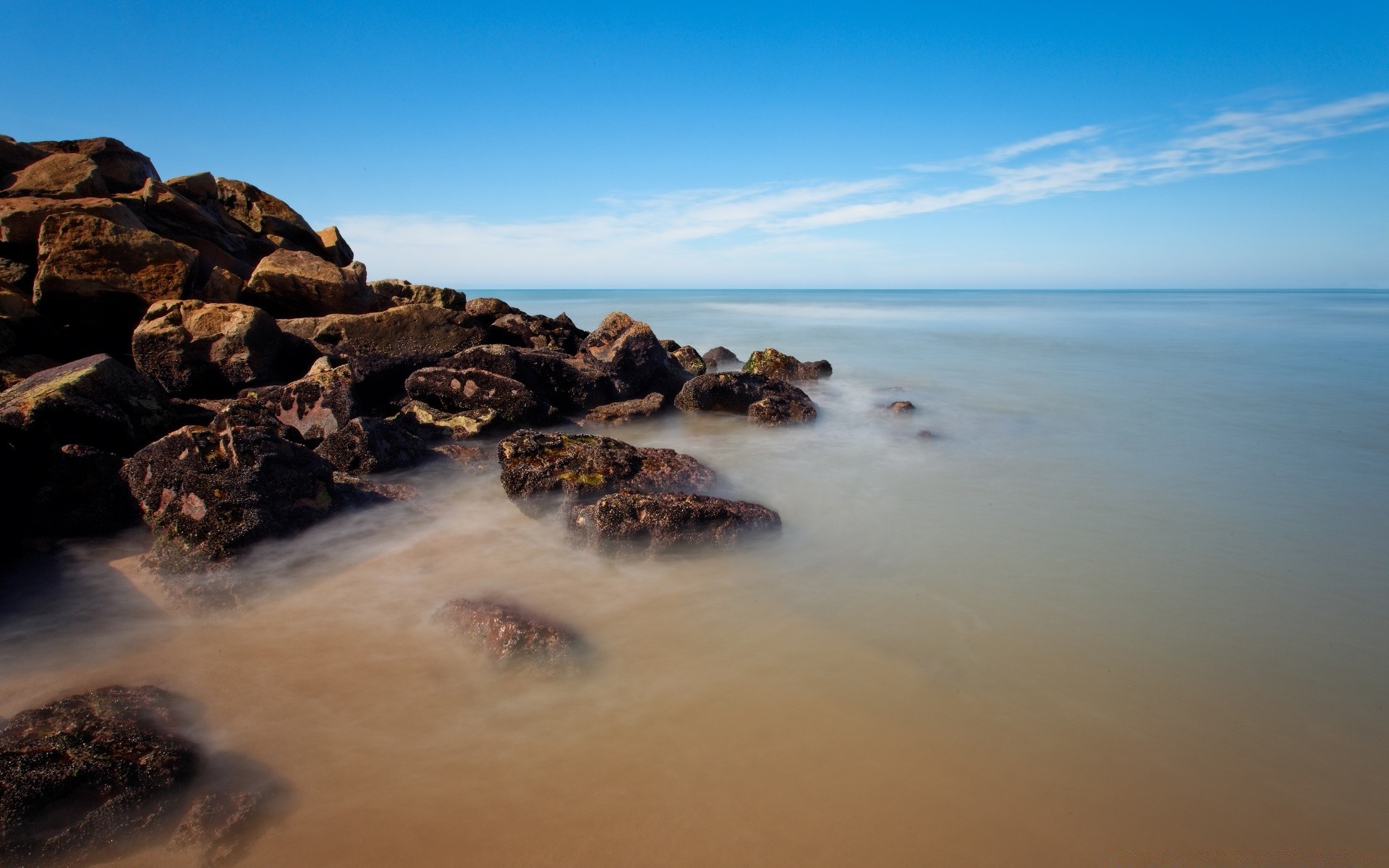 sea and ocean water beach seashore sea ocean sunset landscape seascape rock travel surf sand sky evening scenic