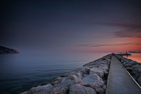 A road in the middle of the sea leading into the distance