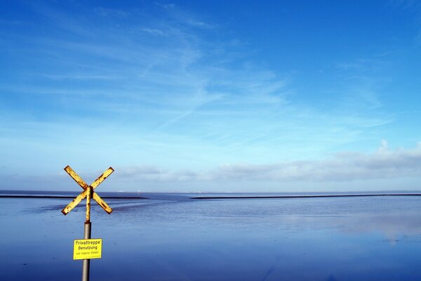 The blue sky is reflected in the water