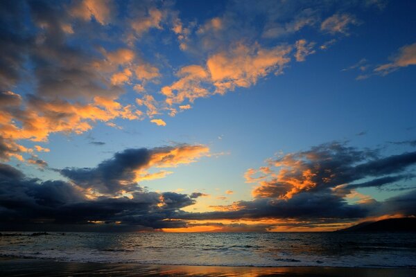 Sunset and sunrise at sea. Small waves