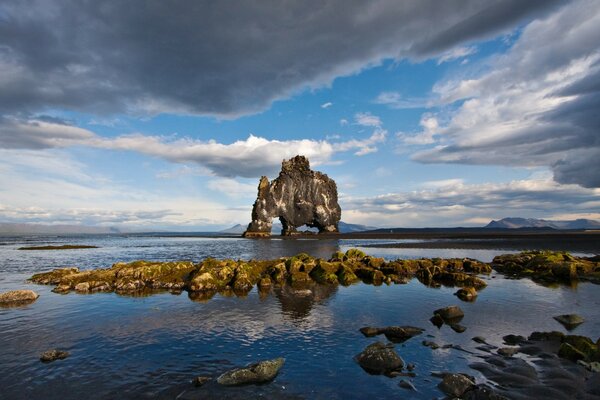 A high rock eroded by the waves of the sea