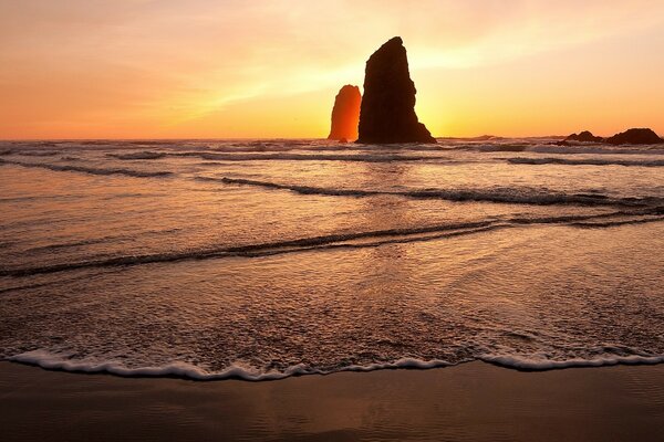 The rock shimmers in the sunset rays