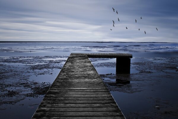 L-shaped bridge on the gloomy sea