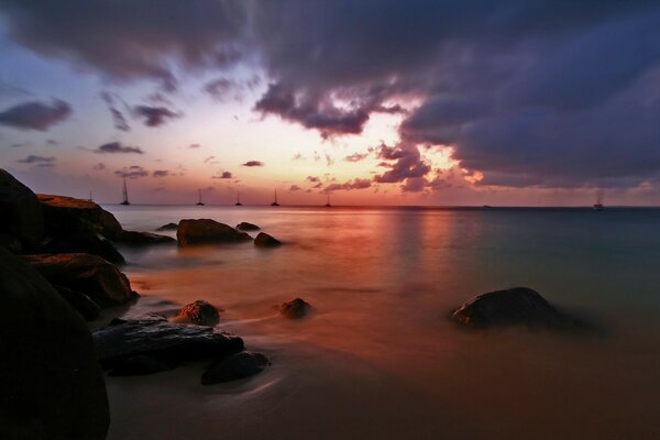 Red sunset in the reflection of the ocean