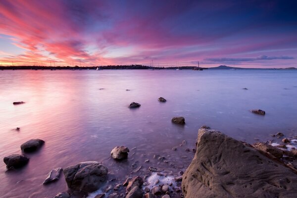 Stones in the water of the night ocean