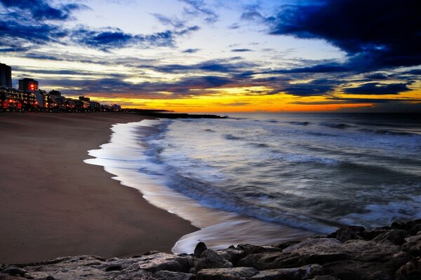 Evening beach, illuminated by the last rays of the setting sun