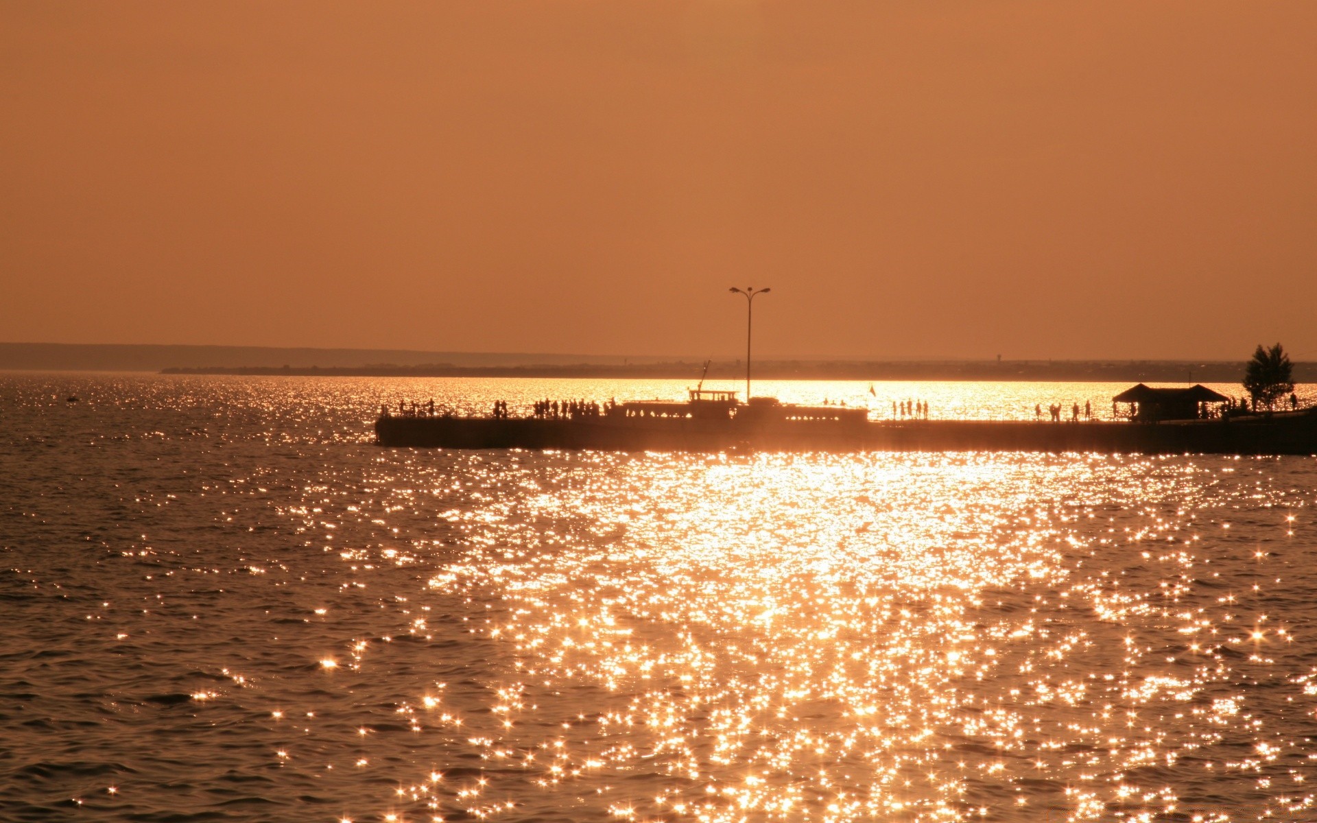 sea and ocean water sunset sea beach dawn ocean sun dusk evening travel sky seashore boat summer watercraft transportation system