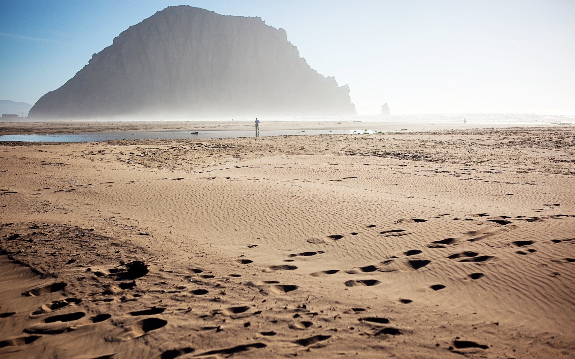 sea and ocean sand beach water seashore desert ocean travel sea surf landscape footprint sunset sun wave island dawn alone fair weather barren