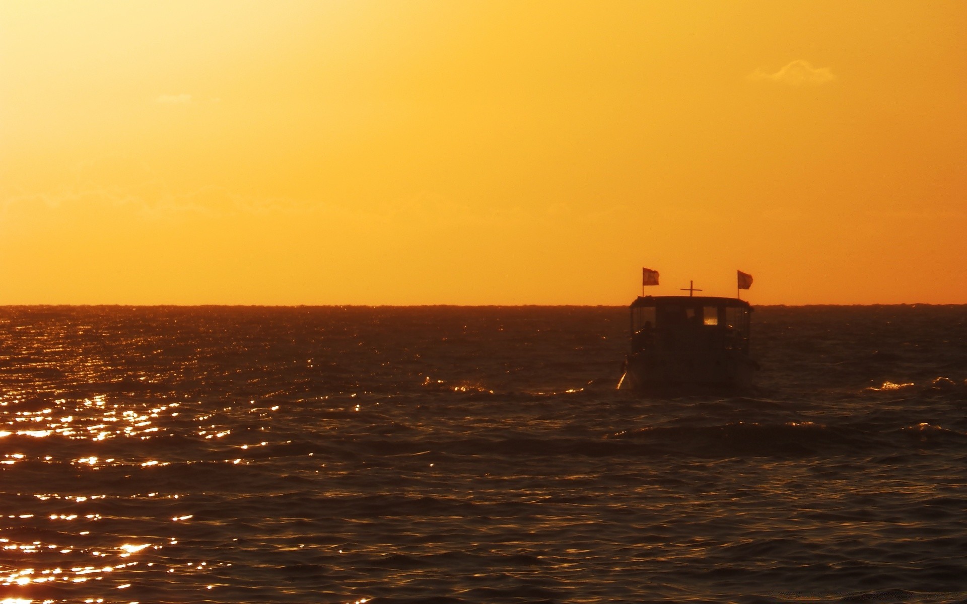 sea and ocean sunset water dawn sea ocean evening beach dusk seascape backlit sun landscape seashore vehicle watercraft travel light sky transportation system