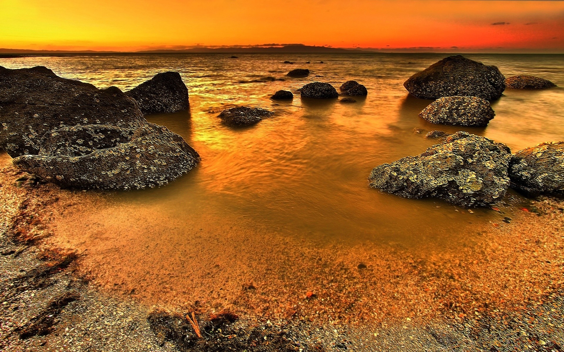 sea and ocean beach sand nature sea water seashore ocean sunset rock sun landscape seascape travel tide shore dawn outdoors summer sky