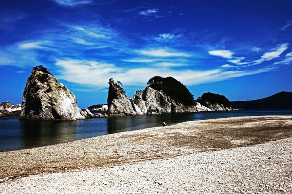 A family of rocks on a sandy beach