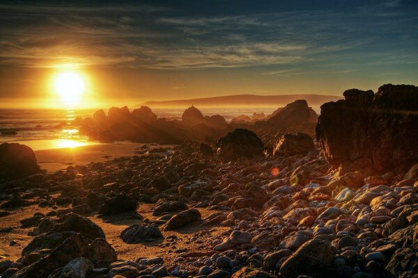 Rocky shore against the bright sun