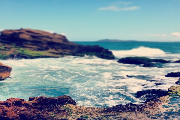 The sea coast with emerald water