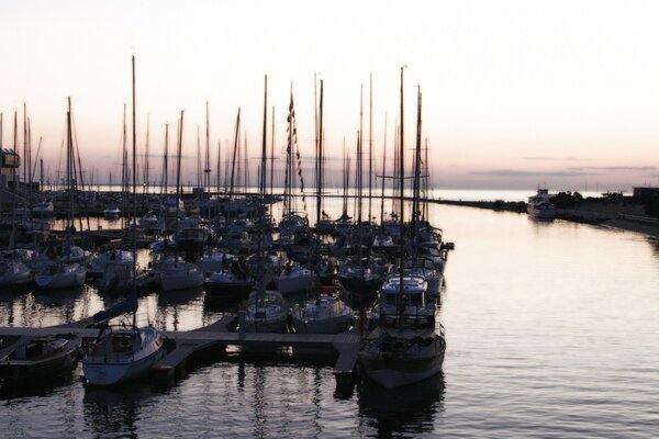 Yacht parking in the bay after sunset