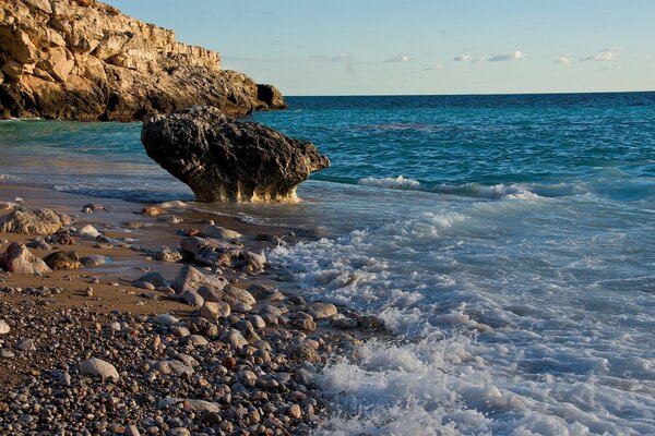 Rocky sea beach among rocky shores