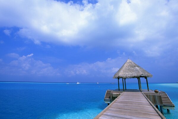 Gazebo on the edge of the bridge in the sea