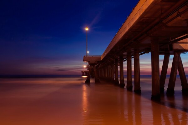 The bridge over the sea water illuminated by phanaries