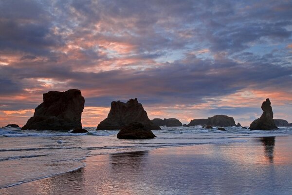 Rocks in the sea at sunset