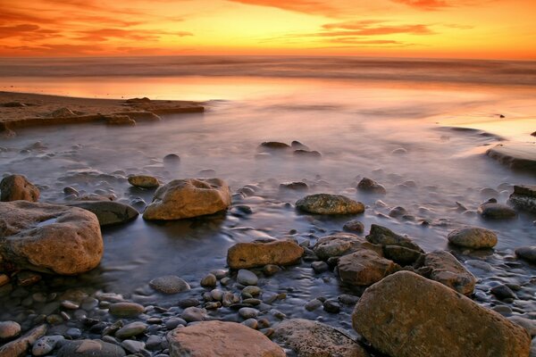 Rocky seashore at sunset