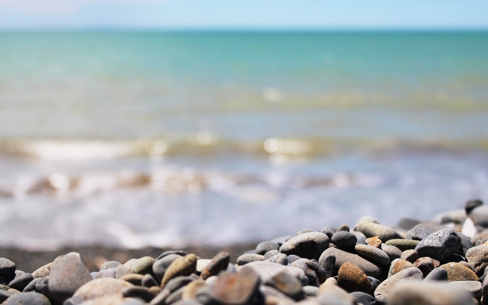 sea and ocean beach sea seashore water ocean nature shore travel sky rock sand landscape desktop stone outdoors sunset